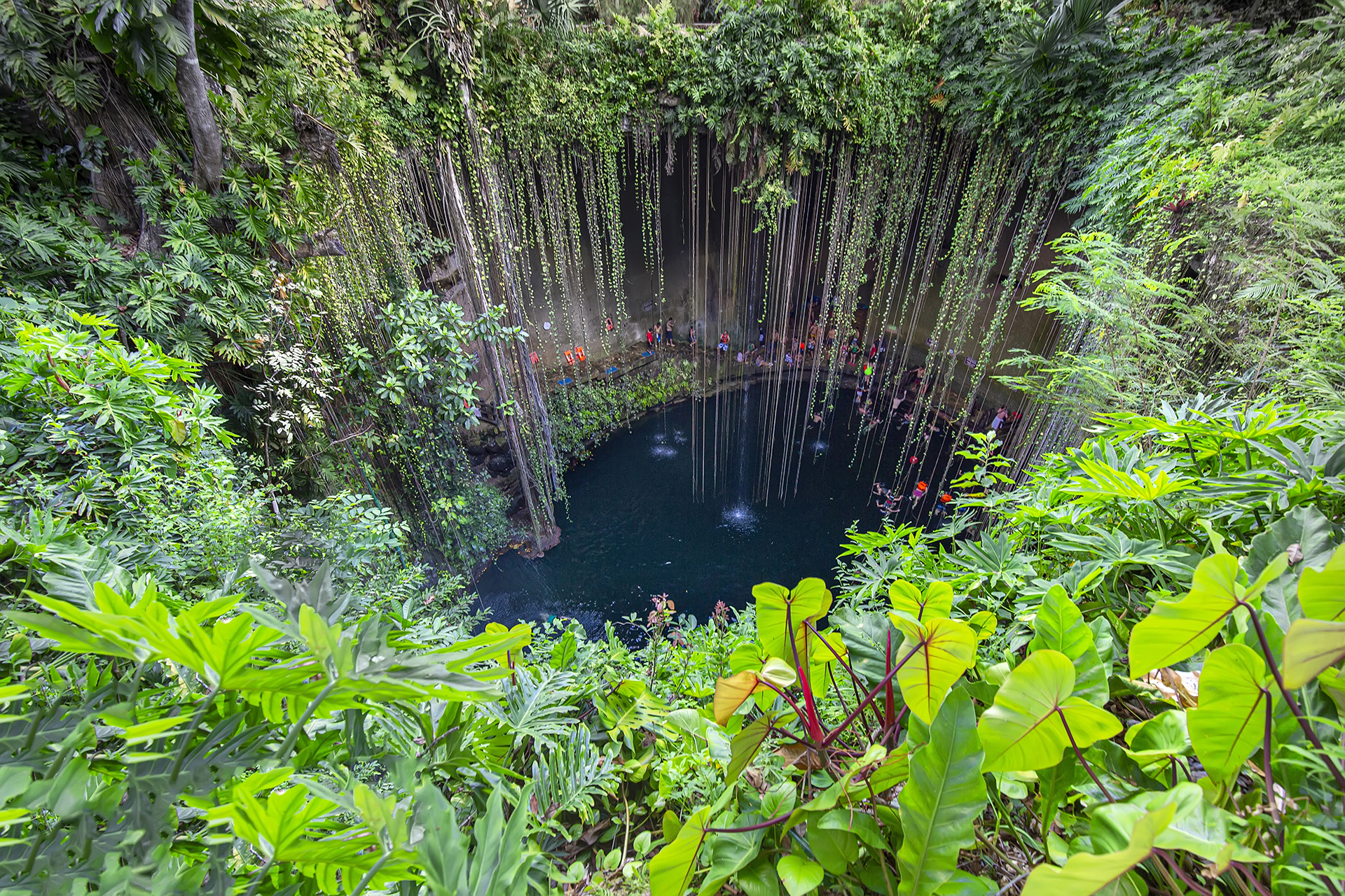 Ik Kil, Mexico - 20 December, 2019: Ik Kil Cenote located in the northern center of the Yucatán Peninsula, a part of the Ik Kil Archeological Park near Chichen Itza